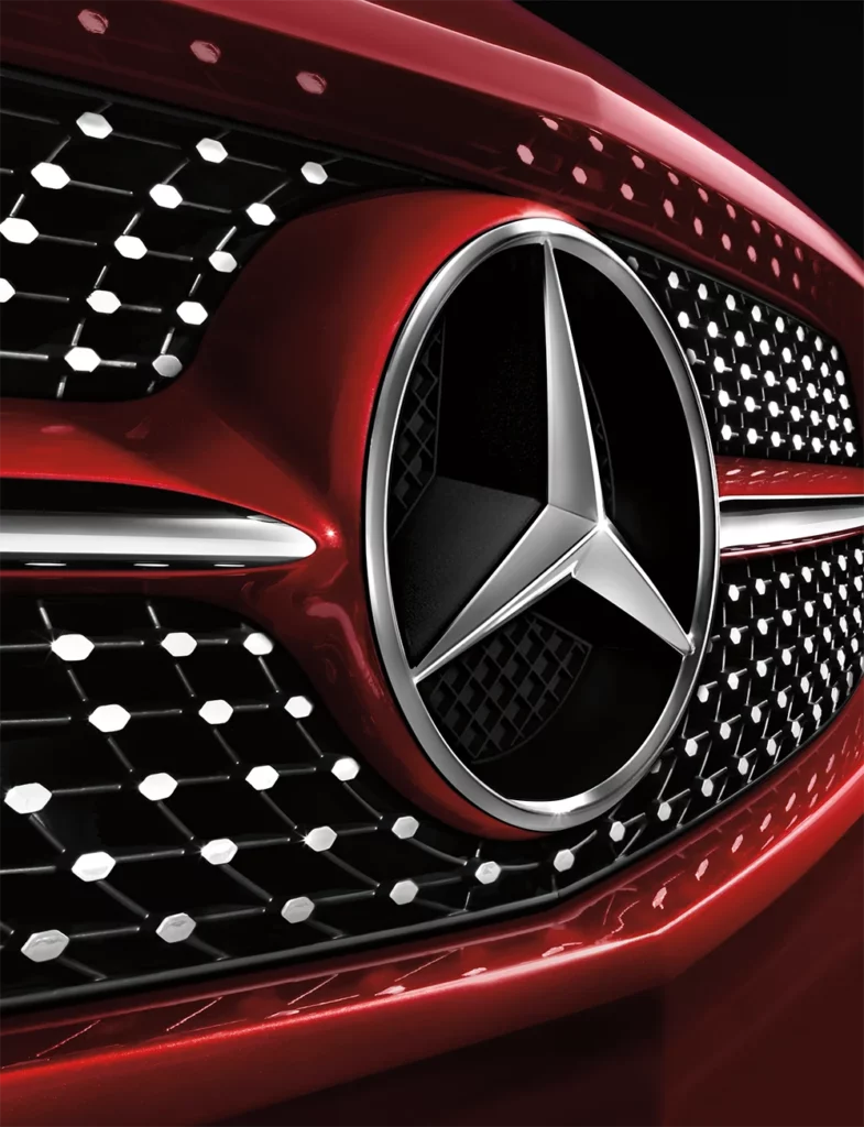 Mercedes Benz logo on grill of car